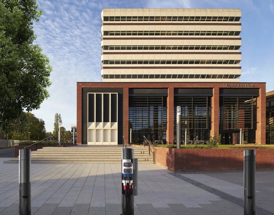 image showing three power bollards outside a university building